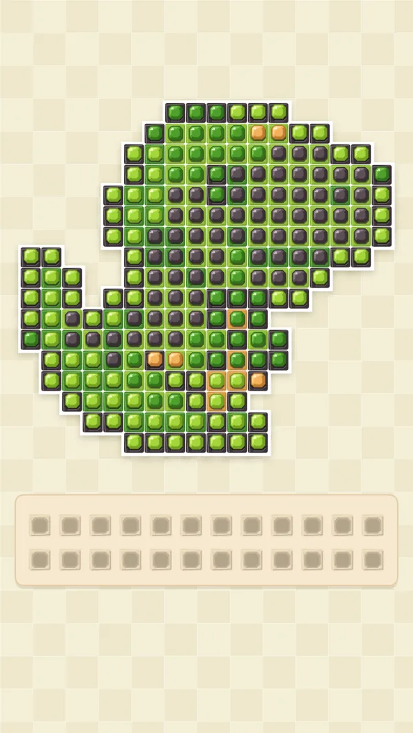 A dinosaur drawn in green gems on a cream board, with a tray of spare gems underneath.